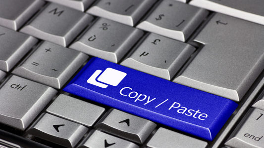 K18 A close-up of a "Copy/Paste" key on a keyboard.