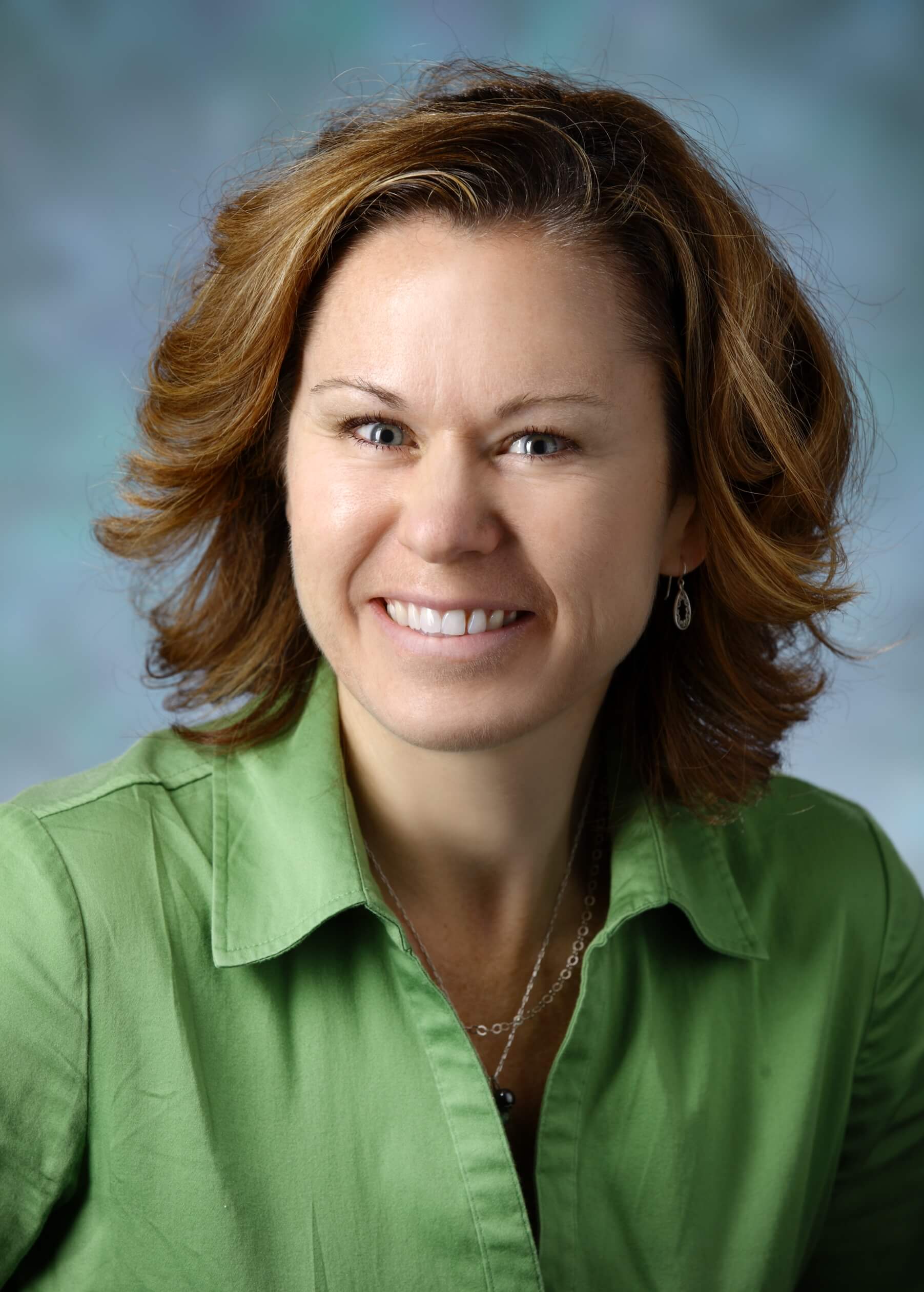 Kathleen T. Bechtold, Ph.D., ABPP wearing a green top in a professional portrait.