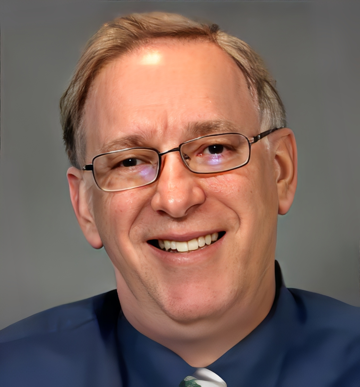 Philip Stahl, Ph.D., ABPP, wearing a suit and glasses, posing for a professional headshot.