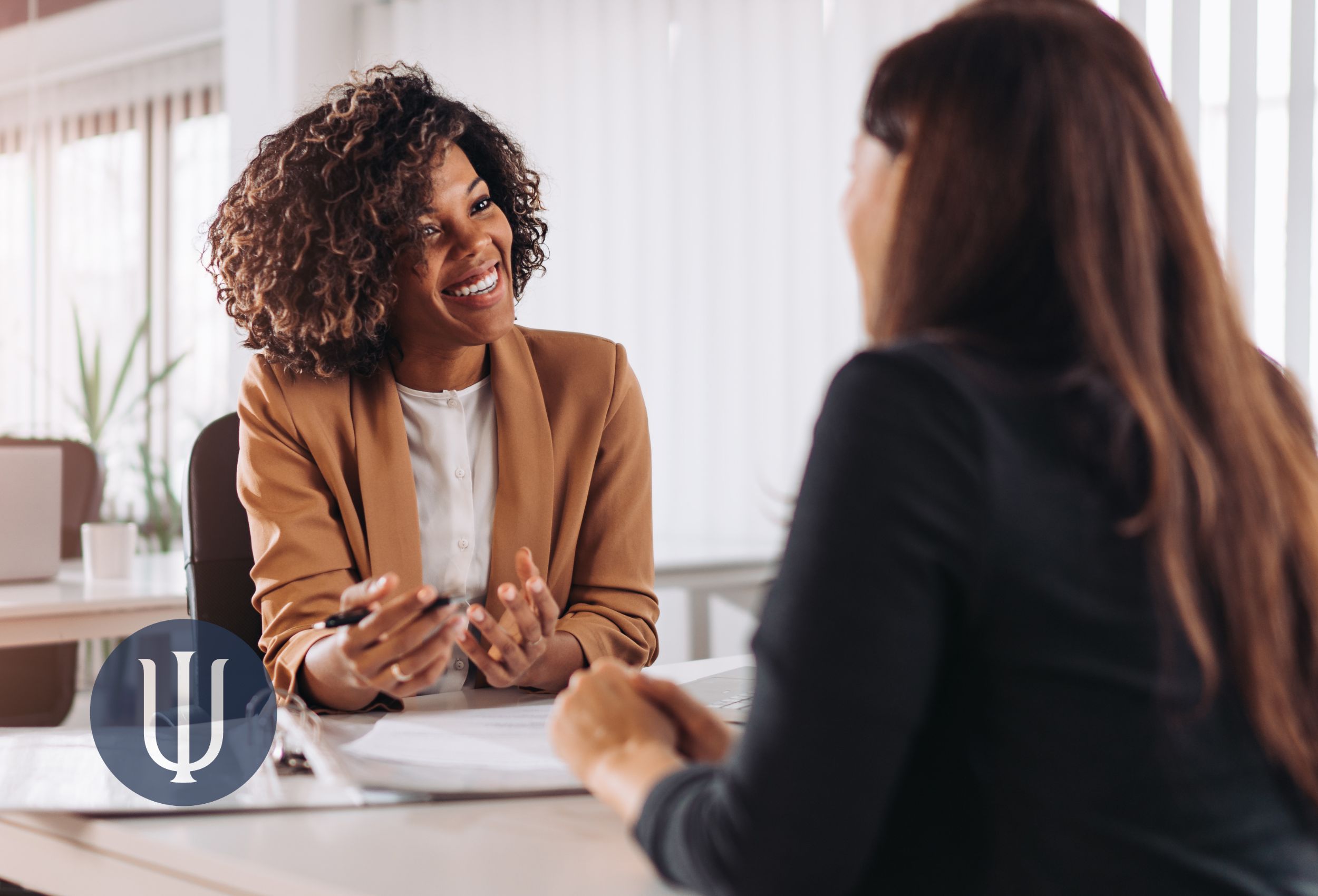 Woman meets with a consultant on risk management in the practice of psychology
